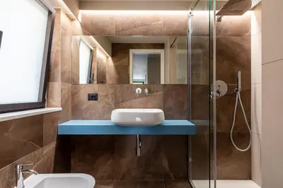a bathroom with a sink and a glass shower at Villa vista mare con piscina a sfioro a Scopello in Castellammare del Golfo