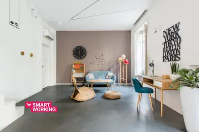 a living room with a desk and a chair at Casa Roma nel Cuore di Palermo by Wonderful Italy in Palermo