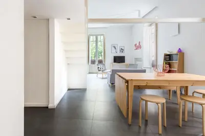 a kitchen and dining room with a table and chairs at Casa Roma nel Cuore di Palermo by Wonderful Italy in Palermo