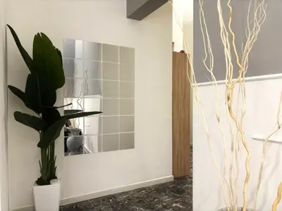 a bathroom with a mirror and a potted plant at Enne's Apartments in the heart of Palermo in Palermo