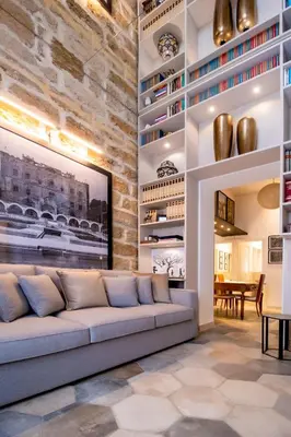 a living room with a couch and a table at Zisa Suite in Palermo