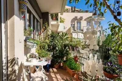 a patio with potted plants on the side of a building at Large Room e Small Private Bathroom Between Mondello Beach and Old Town! Free Park! in Palermo