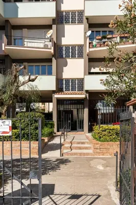 an apartment building with stairs in front of it at Large Room e Small Private Bathroom Between Mondello Beach and Old Town! Free Park! in Palermo