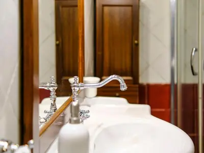 a bathroom sink with a faucet and a mirror at Villa Carta Fashion by Interhome in Terrasini