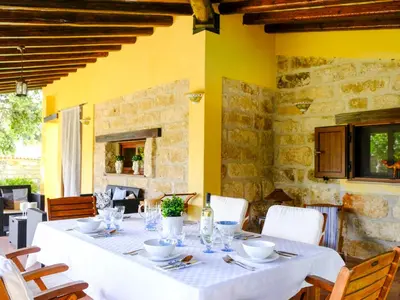 a table in a room with a white table cloth at Villa Carta Fashion by Interhome in Terrasini