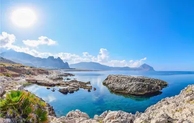 a view of a body of water with rocks at 2 Bedroom Amazing Apartment In Trappeto in Trappeto