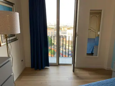 a room with a large glass door to a balcony at CALA MARE in Palermo
