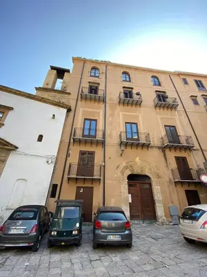 a group of cars parked in front of a building at Monolocale Sant'Andrea in Palermo