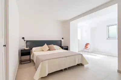 a living room with a couch and a table at Casa Iole by DomuSicily in Mondello