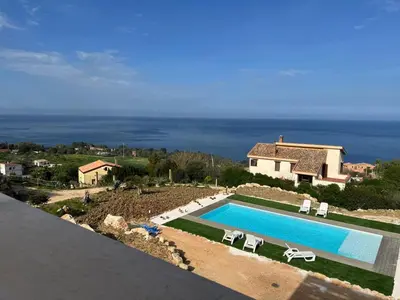 a swimming pool with a view of the ocean at Apt Perterrepermari a 2 Km Da Riserva Dello Zingaro in Scopello