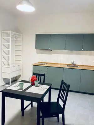 a kitchen with a table and chairs in a room at Da Marlà al Politeama in Palermo