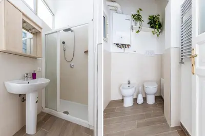 a bathroom with a sink and a toilet at Casa Dante with Balcony by Wonderful Italy in Palermo
