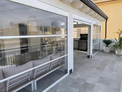 a balcony with sliding glass doors with a view of a kitchen at Al Covo dei Mori in Bagheria