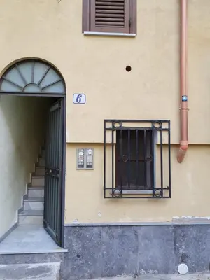 an entrance to a building with a door and stairs at LE CAMERE AL CASSARO in Palermo