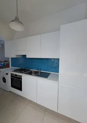 a white kitchen with a sink and a stove at Luxury Villa just 50 mt from the beach, 10 minutes from the airport in Carini