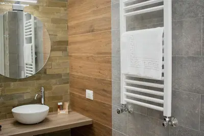 a bathroom with a sink and a mirror at Vicolo del Salto in Palermo