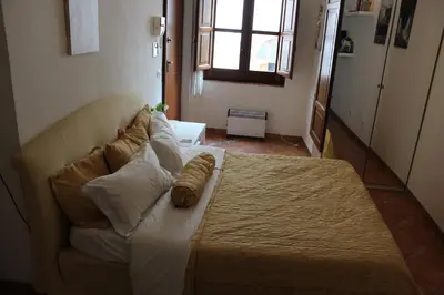 a couch in a living room with at Home Resuttano in Palermo