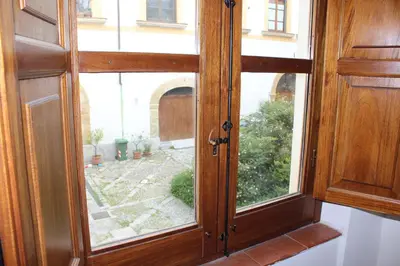 a wooden door with a window in a room at Home Resuttano in Palermo