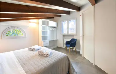 a bedroom with a bed with towels on it at Cozy Home In Partinico With Wifi in Partinico