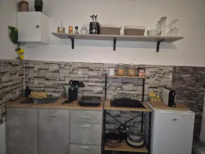 a kitchen with a sink and a counter top at La casuzza 1 in Palermo