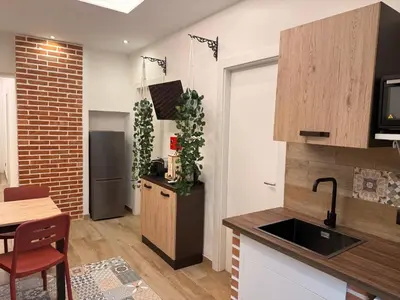 a kitchen with a sink and a counter top at Dimora Palermo with private pool in Palermo