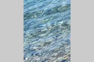 a picture of the water with rocks in it at Sul mare con spiaggetta privata vicino a Cefalù. in Buonfornello