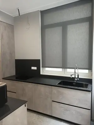a kitchen with a sink and a large window at Granatelli Rooms in Palermo