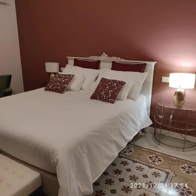 a large white bed with two pillows on it at Le stanze di Bianca in Palermo