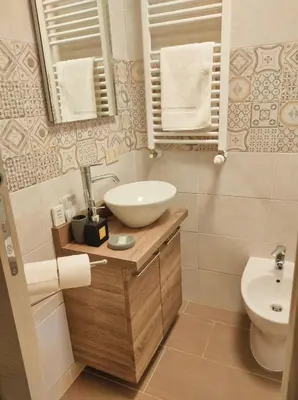 a bathroom with a sink and a toilet at Ai Giudici in Palermo