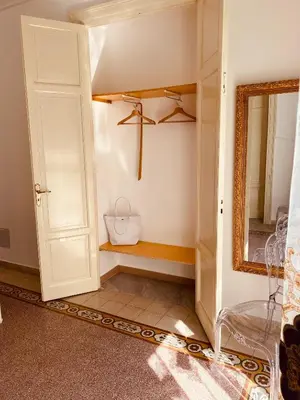 a room with a closet with a mirror and a door at Palermo Center Residenza IN Cattedrale Superior Apartment in Palermo
