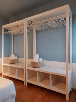 a bedroom with two bunk beds with baskets at Piazza Mondello Lifestyle Home Palermo in Mondello