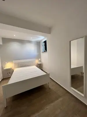 a bedroom with a bed and a mirror at San Saverio Home in Palermo