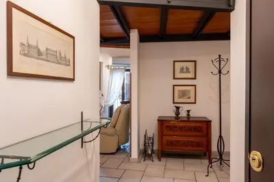 a hallway with a glass staircase in a house at Panormus Cala a Mare by DomuSicily in Palermo