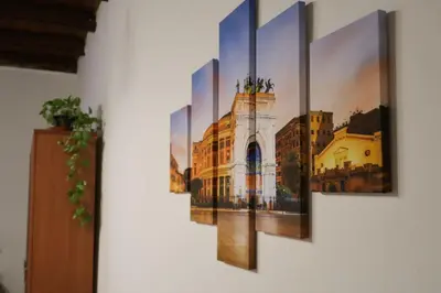a painting of a building on a wall at N'Amuri di Casa in Palermo