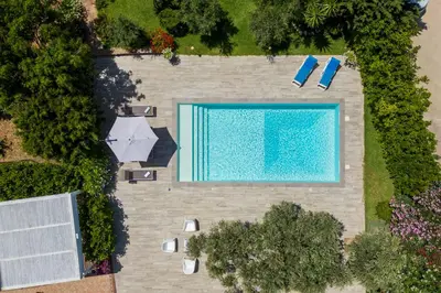 an overhead view of a swimming pool in a yard at VILLA HIBISCUS in Castellammare del Golfo