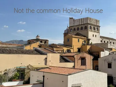 a view of a city with the words not the common holiday house at Meetup on The Terrace View With private parking in Palermo