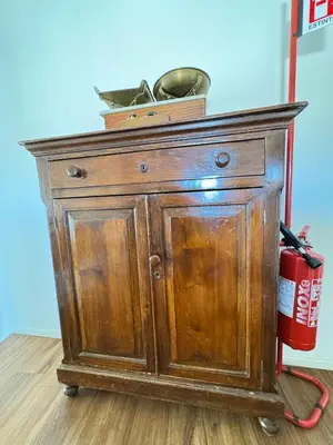 a wooden cabinet with a fire hydrant on top of it at Meetup on The Terrace View With private parking in Palermo
