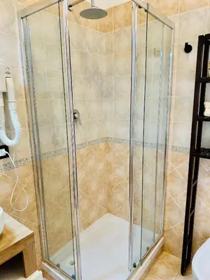 a shower with a glass door in a bathroom at Case Vanella Grande aspra bagheria in Bagheria