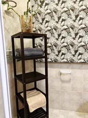 a towel rack in a bathroom with a wall at CASE VANELLA GRANDE aspra Bagheria in Bagheria