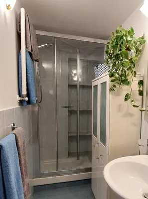 a bathroom with a shower and a sink at Olivuzza Apartment in Palermo