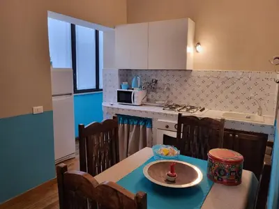a kitchen with a table with a plate on it at Casa da Michelino in Palermo