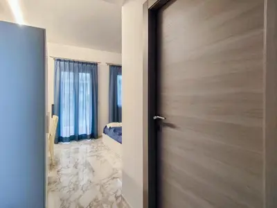 a door leading into a room with a bedroom at Cubacalatafimi Rooms in Palermo