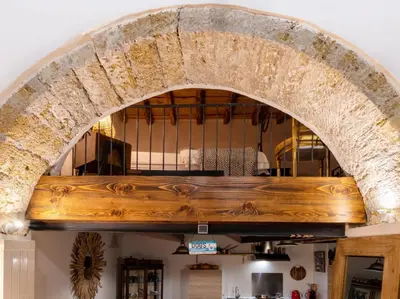 an archway in a building with a wooden counter top at CityCenter Unique Apartment-Sleeps 2- Pet Friendly in Palermo