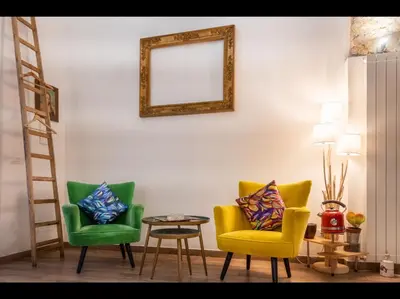 a living room with two chairs and a mirror at CityCenter Unique Apartment-Sleeps 2- Pet Friendly in Palermo