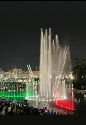 a group of people watching a fountain in the water at Casa Zagato Le Fuoriserie in Palermo