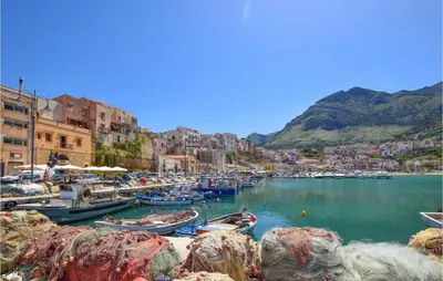 a group of boats are docked in a harbor at Mansarda Belvedere in Alcamo Marina