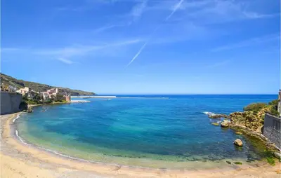 a view of a beach with blue water at Mansarda Belvedere in Alcamo Marina