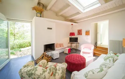a living room with a couch and a fireplace at Nocellara in Alia