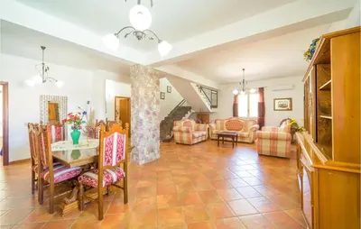 a living room with a table and chairs at Villa Spera in Mandra Capreria