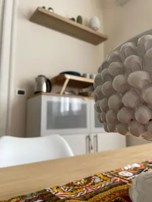 a room with a table with a bunch of balls on it at Arricría Room Suite in Palermo